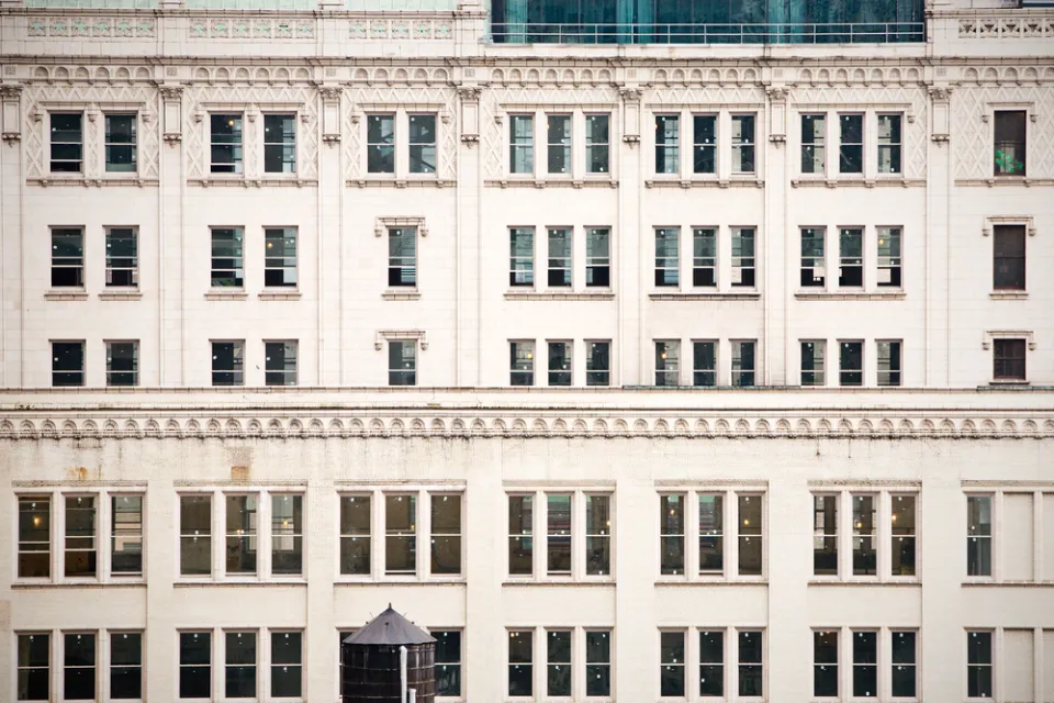 A closeup of rows of buildings lined by old fashioned windows in New York City.